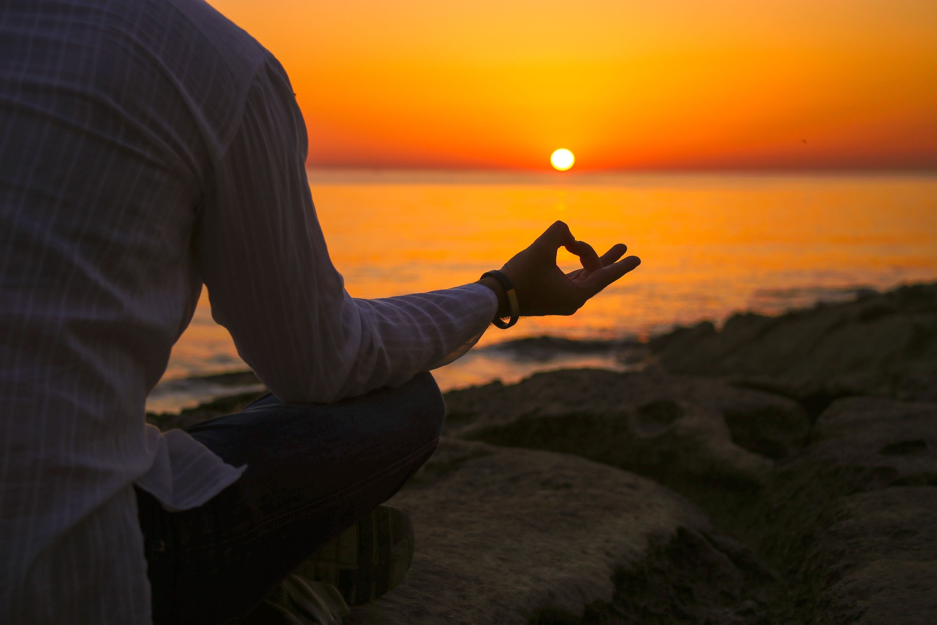 Man meditating at sea close up